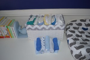 Whale Book Ends and FuzziBunz in a basket.